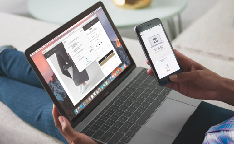 Mac laptop and iphone showing Applepay