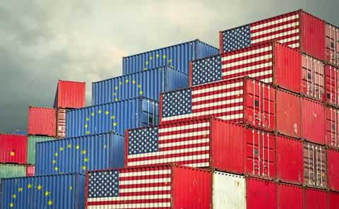 Cargo containers with EU and United States flag - stock photo