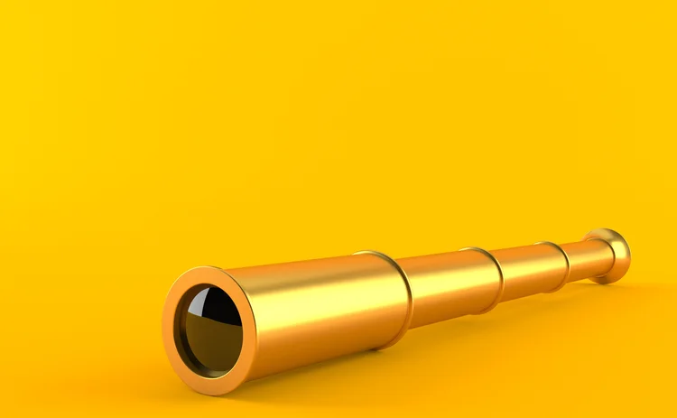 golden telescope on yellow background